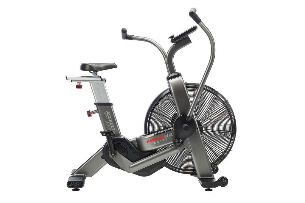 Assault Elite air bike with silver frame, black seat, dual handlebars, and large black fan wheel on white background