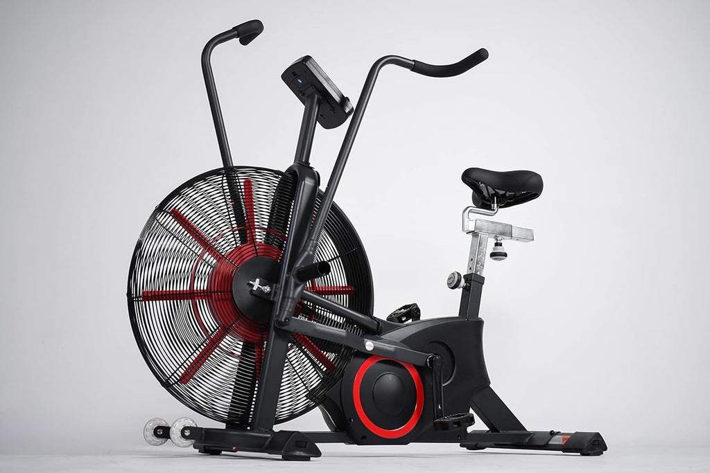 Black and red air exercise bike with large fan wheel, dual handlebars, and black seat on white background
