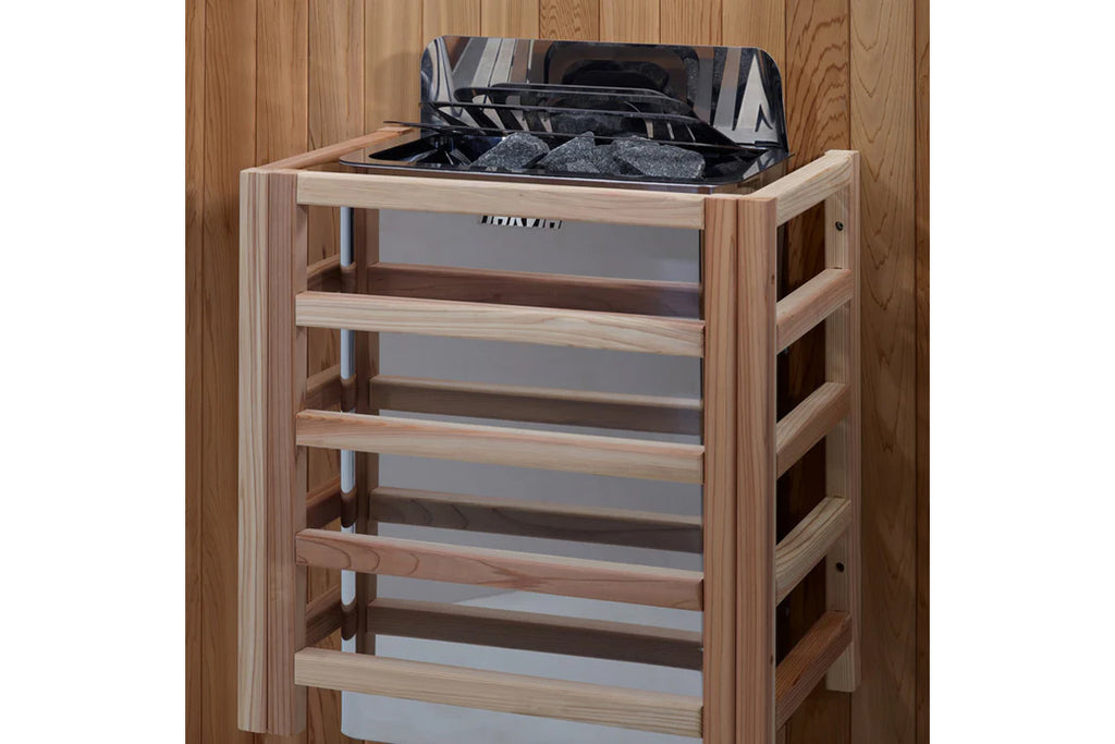 Natural wood sauna stove with black metal top and storage shelves, displayed on wooden floor background