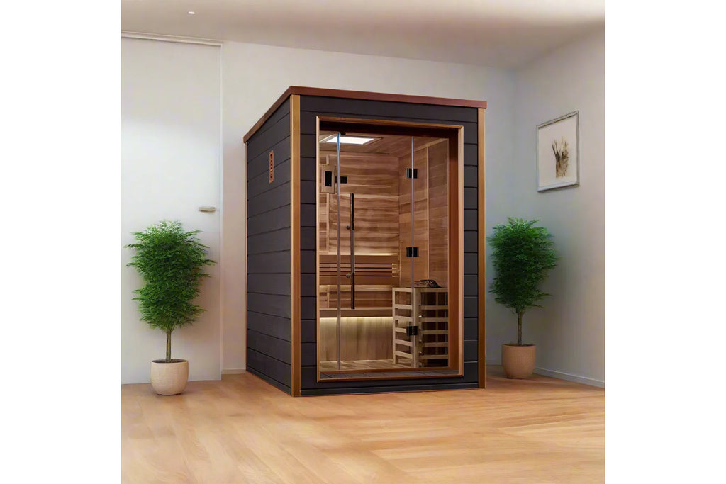 Narvik two-person indoor sauna with black exterior frame, cedarwood interior, glass door with black handles, and wooden bench