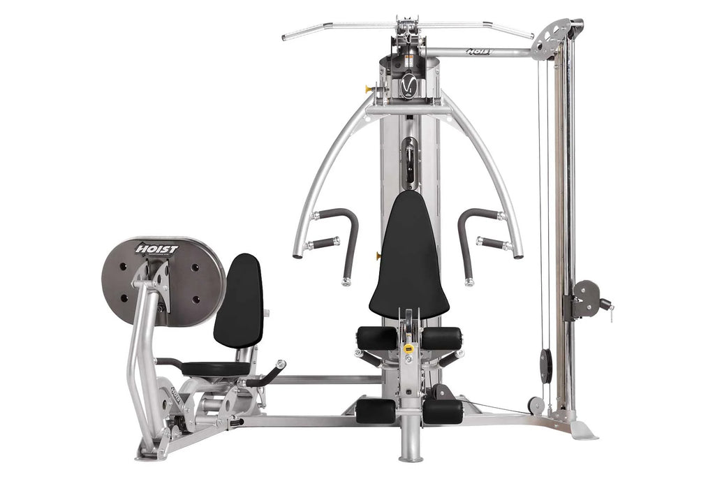 Hoist V1-Elite home gym with silvered metal frame, black padded seat and backrest, dual exercise stations, and weight stack o