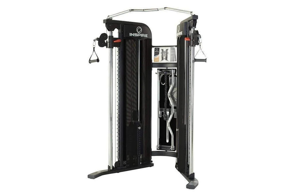 Inspire Fitness FT1 Functional Trainer with dual weight stacks, black frame, silver uprights, and cable attachments on white 
