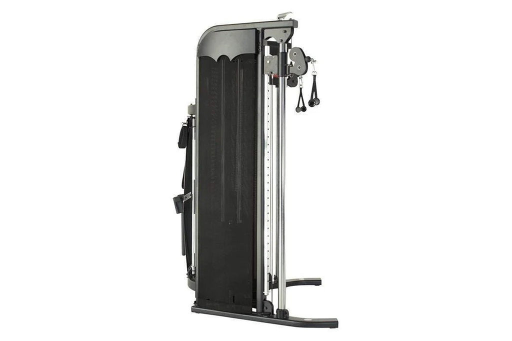 Inspire Fitness FT1 functional trainer with black pad and silver frame, dual cable pulleys and weight stacks on white backgro