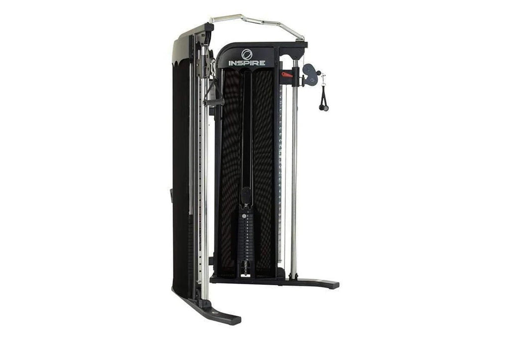 Inspire Fitness FT1 functional trainer with black mesh panels, silver metal frame, and dual cable pulley system on white back
