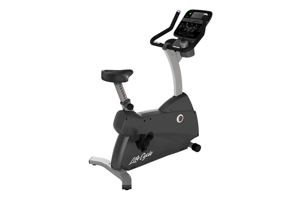 Life Fitness C3 upright exercise bike with black seat, gray frame, digital console with handlebars, on white background