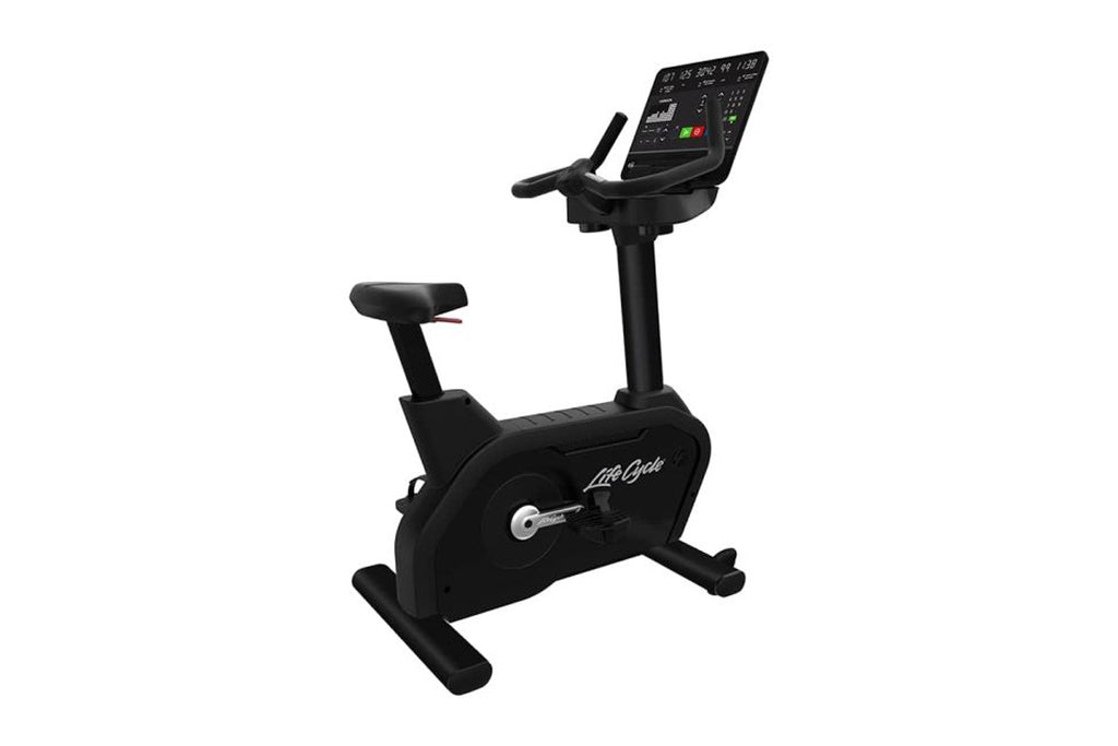 Black Life Fitness Integrity+ upright exercise bike with digital display console and adjustable seat, on white background