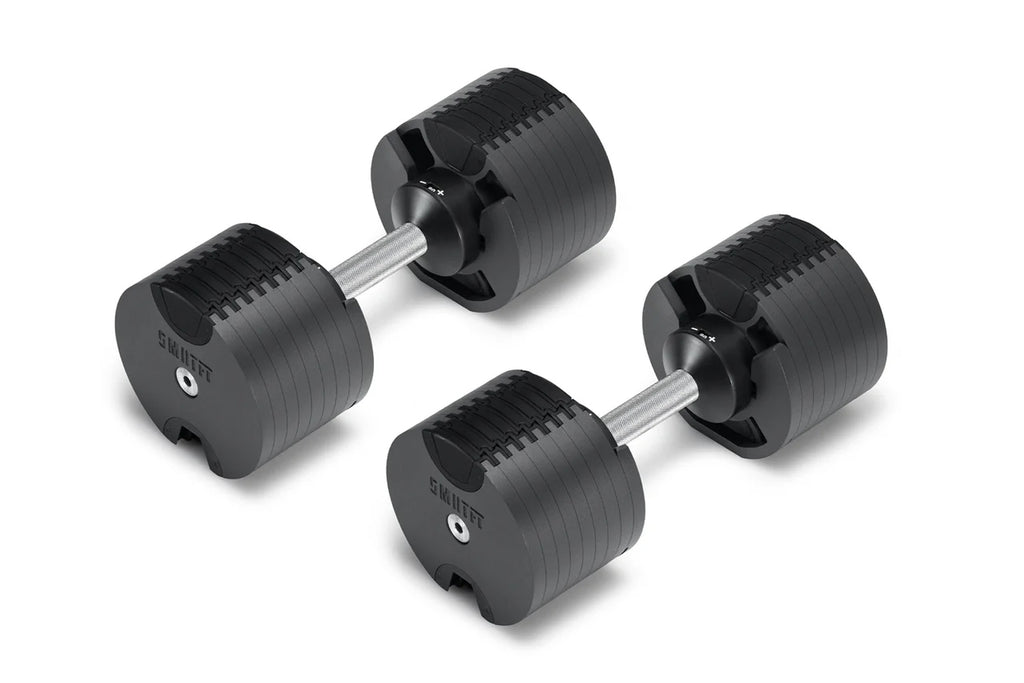 Pair of black adjustable dumbbells with chrome handles and weight plates labeled NÜOBELL, displayed on white background