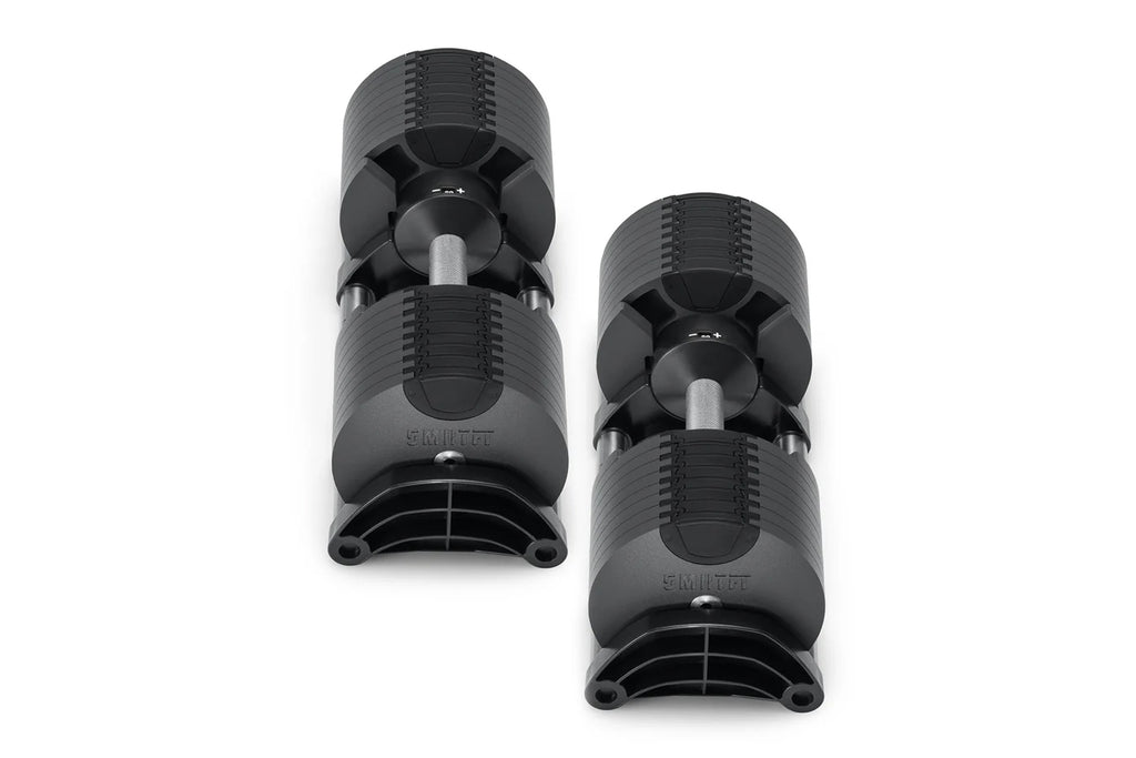 Pair of black NÜOBELL adjustable dumbbells with ribbed handles and silver connecting rods on white background