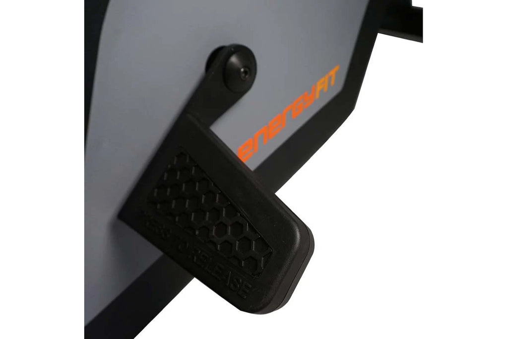 Gray and black SKI-ROW AIR rowing machine with orange logo text, showing footrest detail and handle mechanism on white backgr