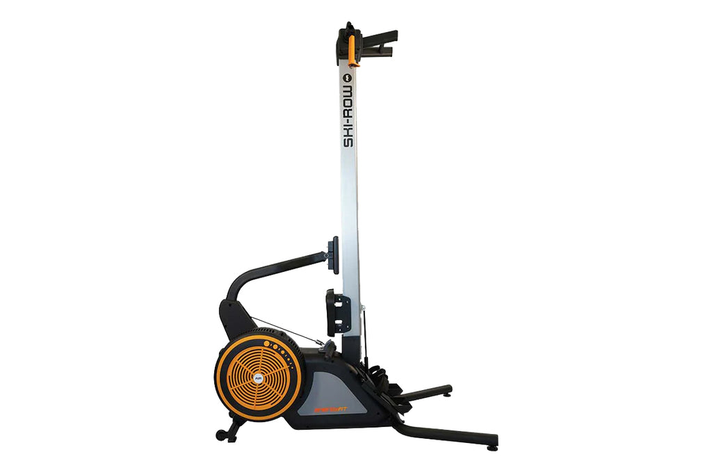 SKI-ROW AIR rowing machine with black frame, white vertical rail, orange and black flywheel, and extended footrest on white b