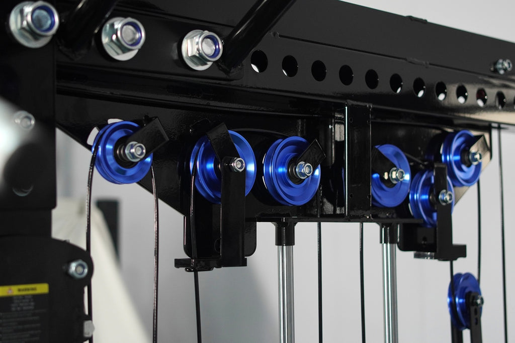 Black cable crossover machine with blue pulleys and metal frame, gym ...