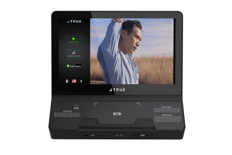 TRUE Envision II 22-inch black touchscreen console displaying fitness workout video on screen, shown on white background