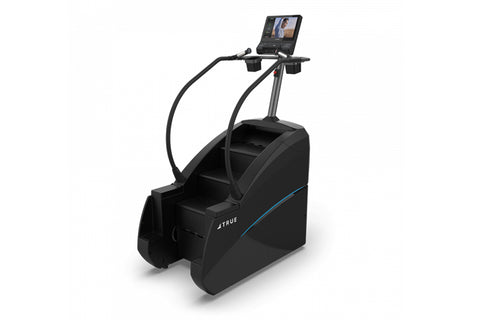 TRUE commercial stair climber with blue accent stripe, digital display console, and curved handrails on white background