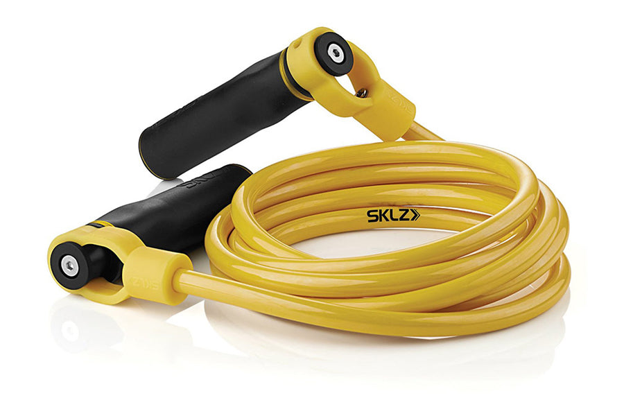 SKLZ weighted jump rope with yellow PVC cord, black foam handles, and adjustable ball bearings on white background