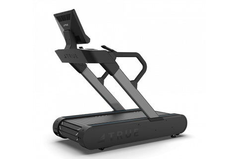 TRUE Stryker Slat Treadmill with black and gray frame, dual handles, and touchscreen display showing workout content on white