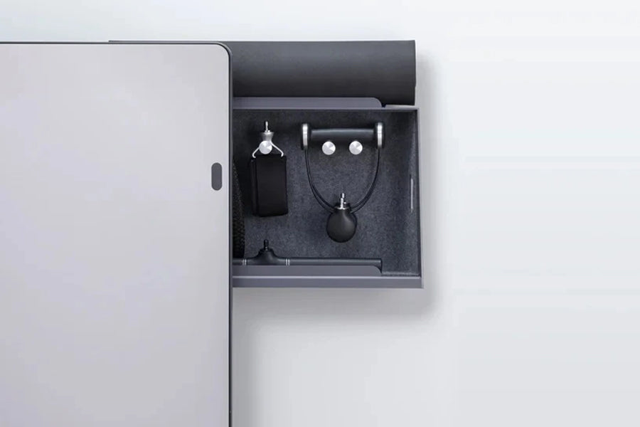Lululemon Studio Mirror with open drawer displaying black audio accessories including earbuds, charging case, and necklace co